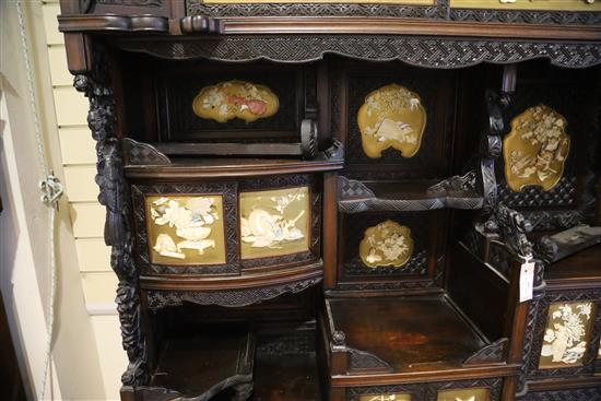 A Japanese Meiji period carved wood and shibayama cabinet, W.4ft 10in. D.1ft 4in. H.7ft 11in.
